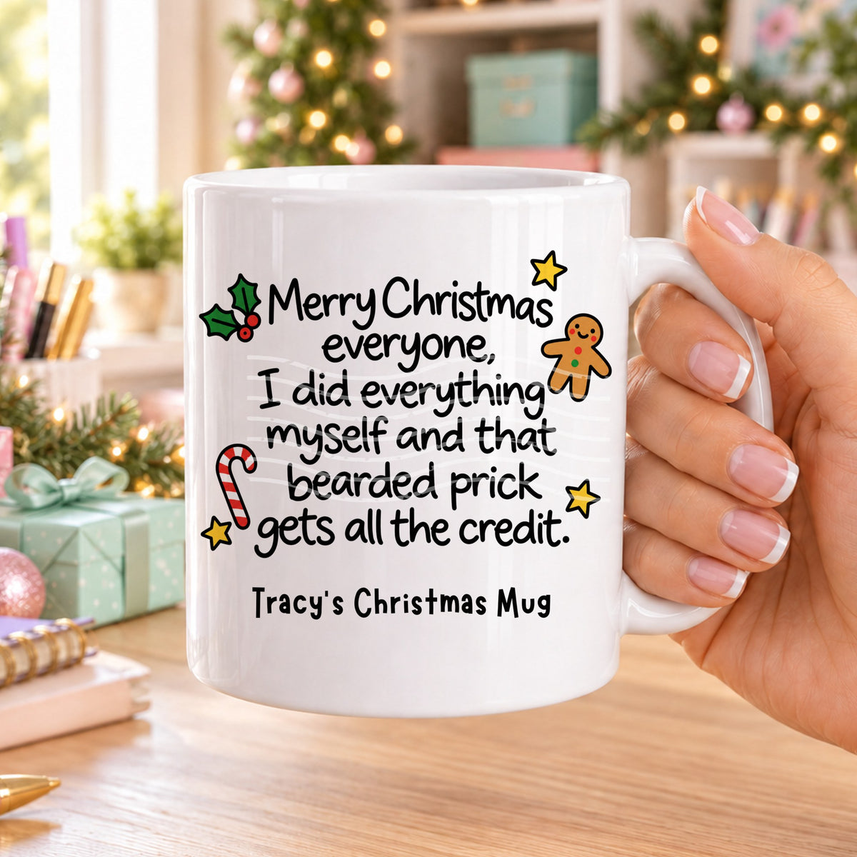 White personalised funny Christmas mug printed with “Merry Christmas everyone, I did everything myself and that bearded prick gets all the credit.” with holly, a gingerbread man, candy cane and stars, and the line “Tracy’s Christmas Mug” underneath