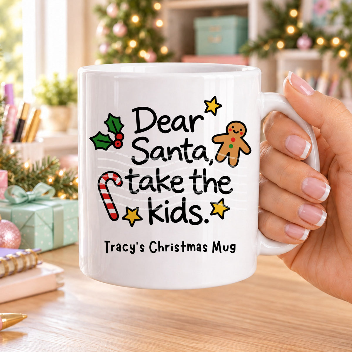 White personalised funny Christmas mug printed with “Dear Santa, take the kids.” with holly, a gingerbread man, candy cane and stars, and the line “Tracy’s Christmas Mug” underneath