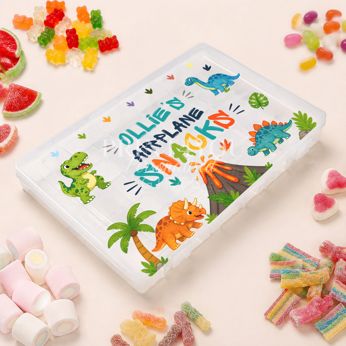 Personalised children's travel snack box with colourful dinosaurs and prehistoric scenery