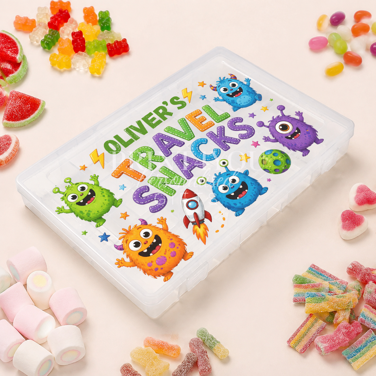Personalised children's travel snack box featuring colourful friendly monsters and a rocket