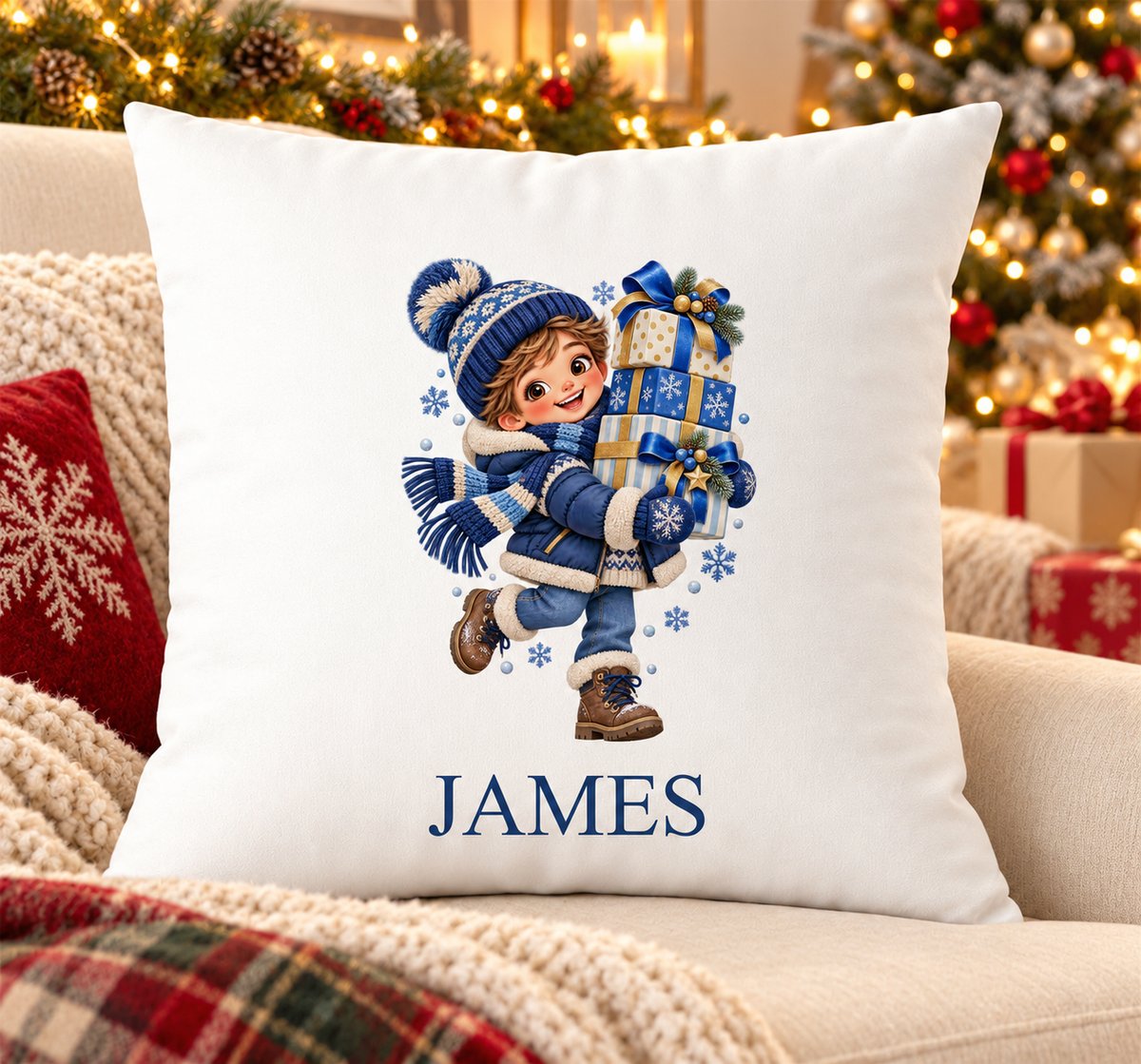 Personalised white Christmas cushion with a boy in navy knits carrying a stack of presents and a name printed underneath, on a festive sofa