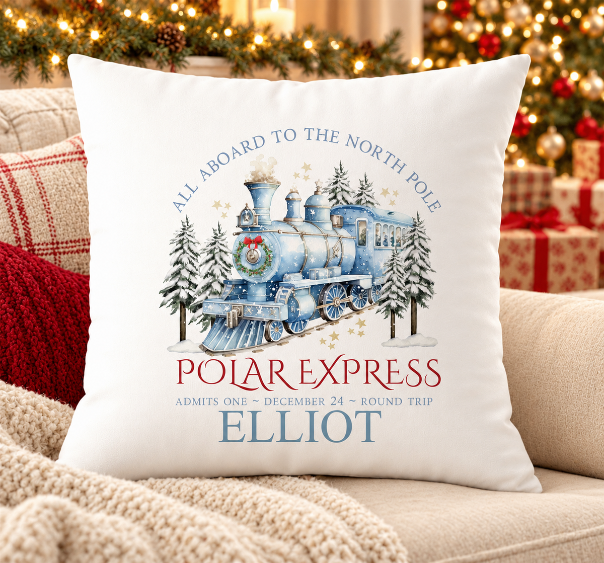 Personalised white Christmas cushion with a blue steam train travelling to the North Pole and a name printed underneath, on a festive sofa