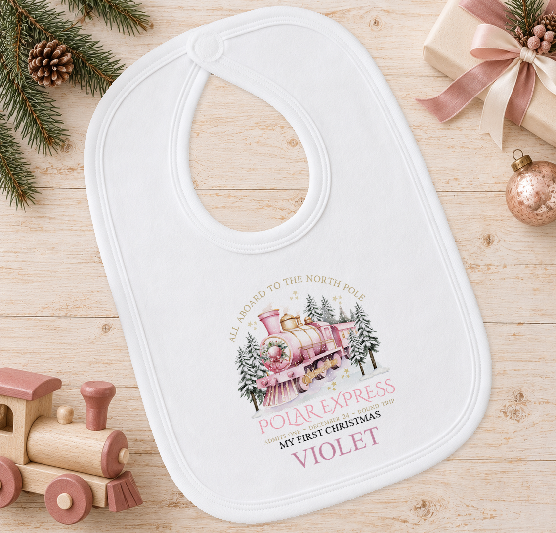 Personalised All Aboard North Pole Train Pink baby Christmas bib with a custom name