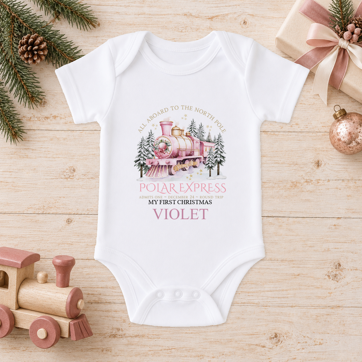 Personalised All Aboard North Pole Train Pink baby Christmas vest with a custom name