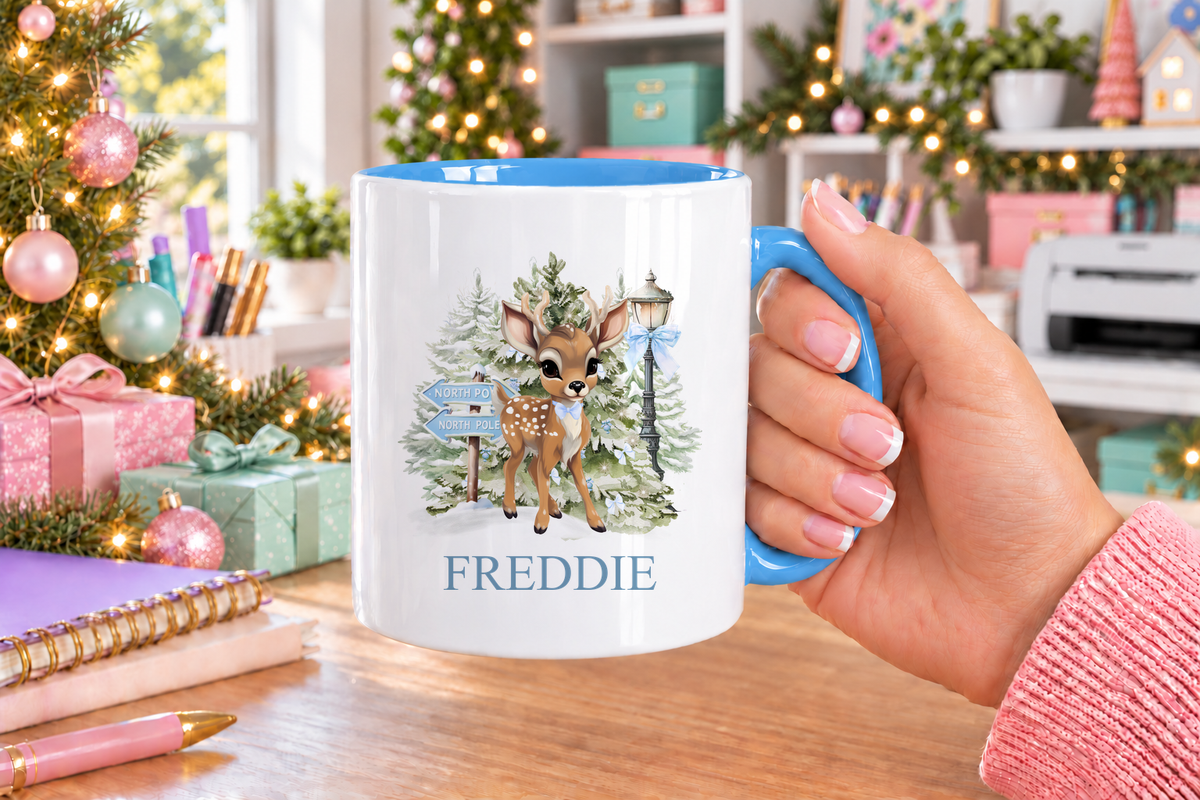 Personalised North Pole Fawn Blue Bow Christmas mug – blue handle with a custom name