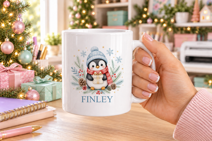 Personalised Penguin with Present Christmas mug – white mug with a custom name