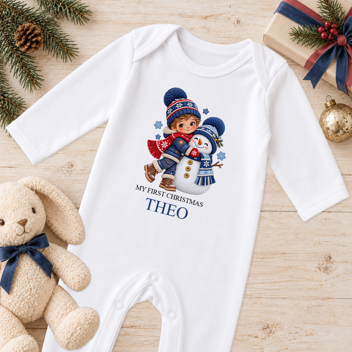 Personalised Boy Hugging Snowman baby Christmas sleepsuit with a custom name