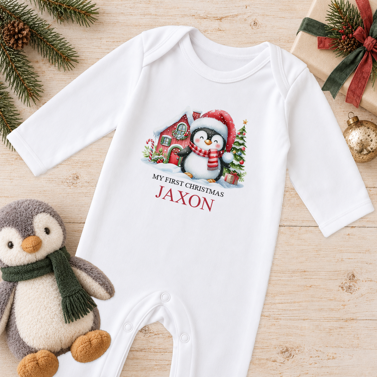 Personalised Santa Hat Penguin baby Christmas sleepsuit with a custom name
