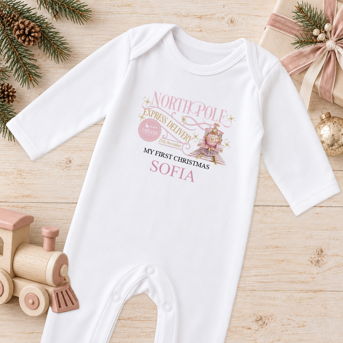 Personalised North Pole Express Pink Train baby Christmas sleepsuit with a custom name