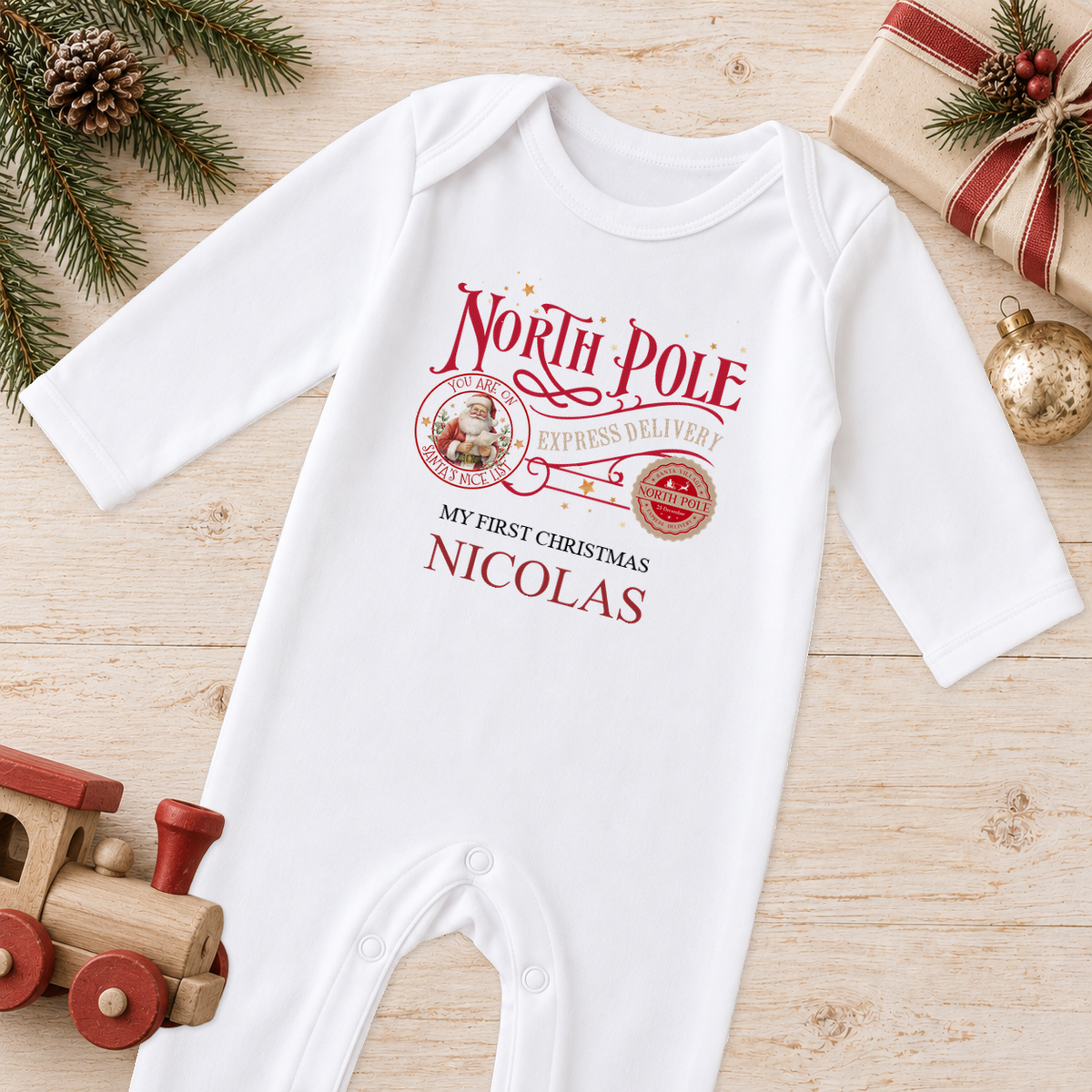 Personalised North Pole Express Santa Stamp baby Christmas sleepsuit with a custom name