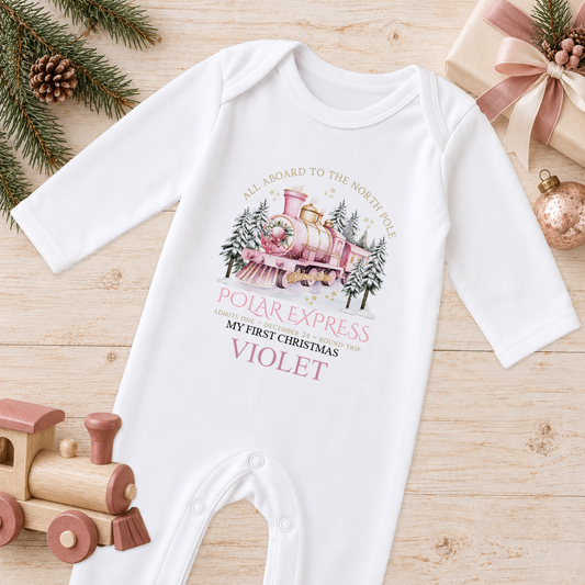 Personalised All Aboard North Pole Train Pink baby Christmas sleepsuit with a custom name