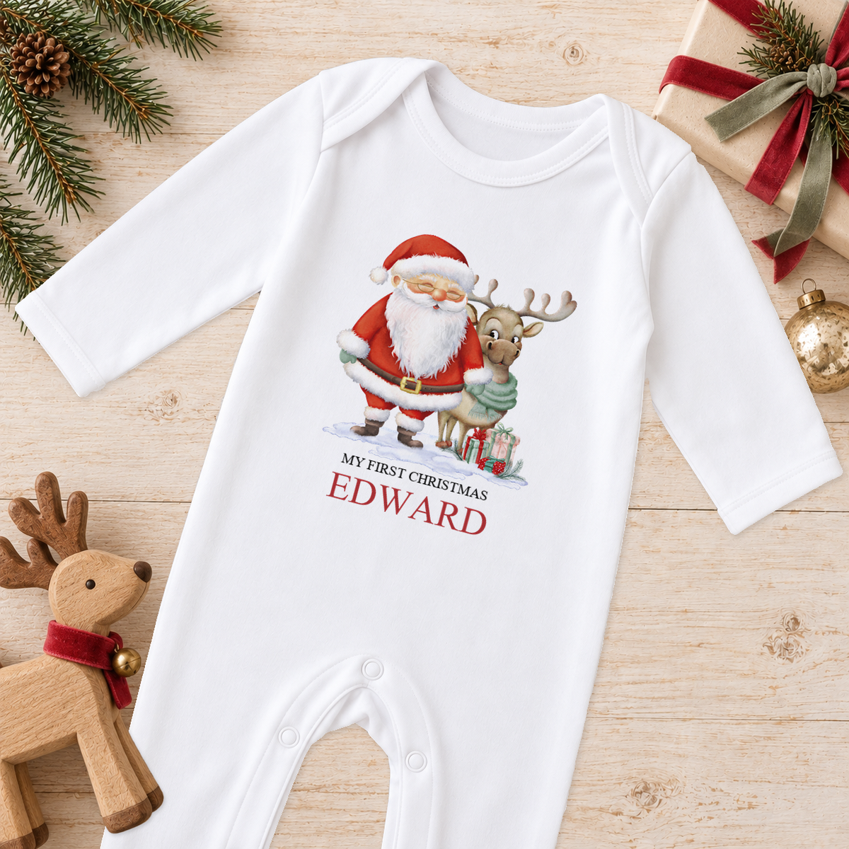 Personalised Santa and Reindeer baby Christmas sleepsuit with a custom name