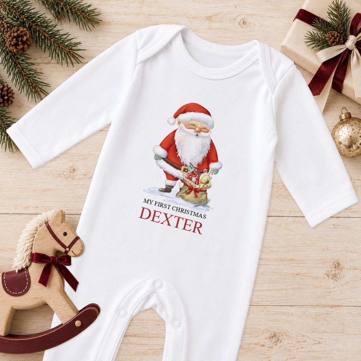 Personalised Santa and Toy Sack baby Christmas sleepsuit with a custom name