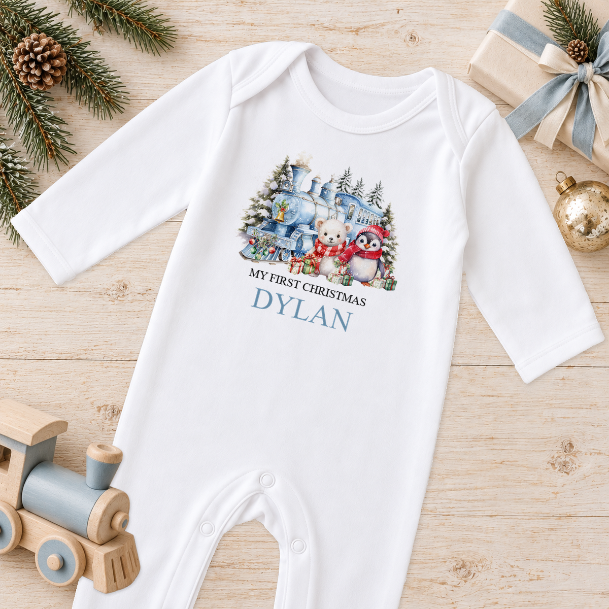 Personalised Winter Christmas Train baby Christmas sleepsuit with a custom name
