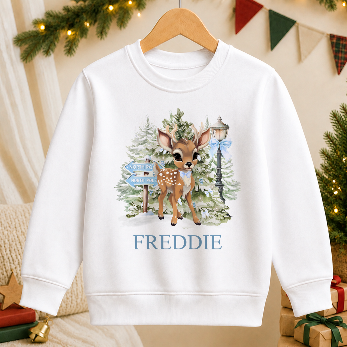 Personalised North Pole Fawn Blue Bow kids Christmas sweatshirt in white with a custom name