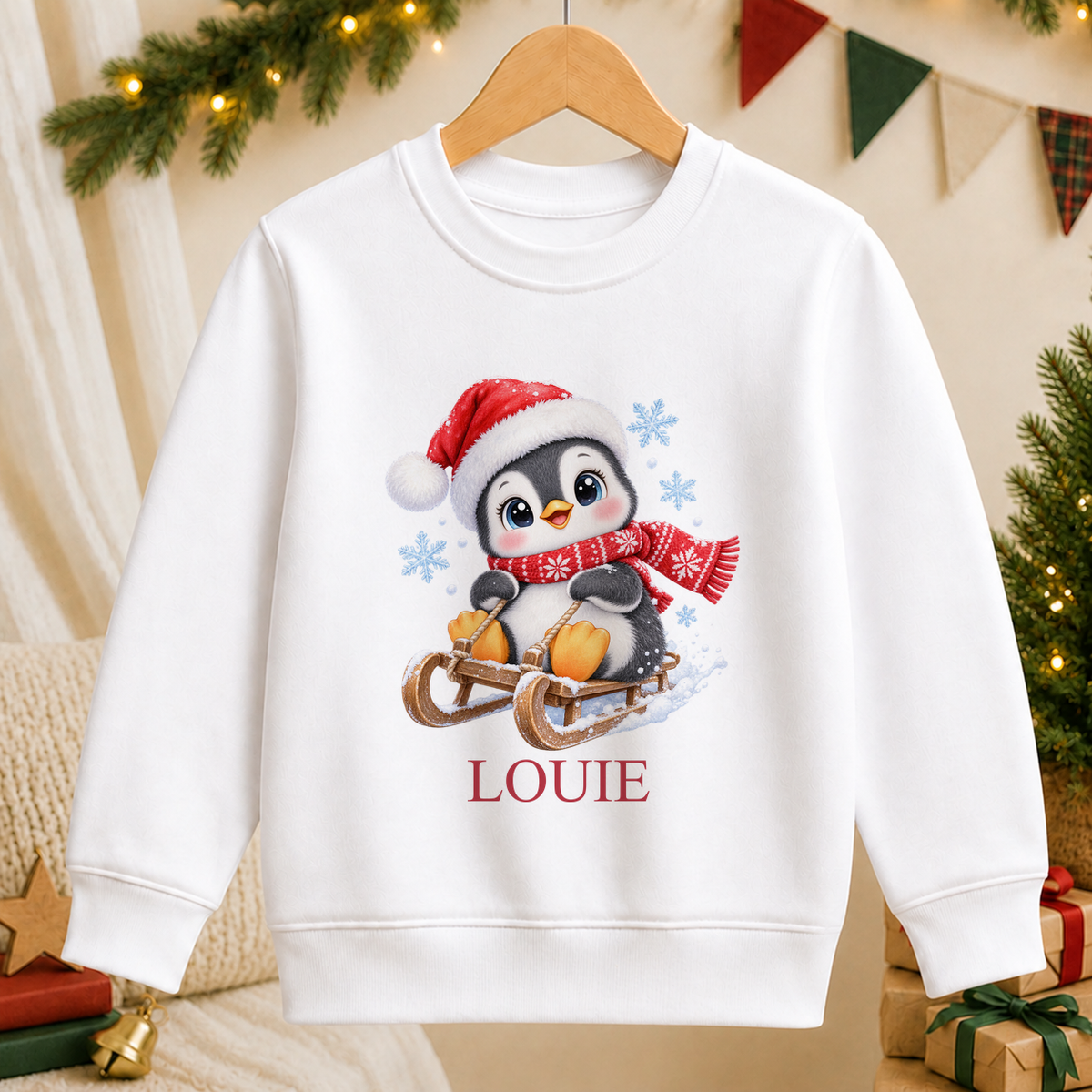 Personalised Sledging Penguin kids Christmas sweatshirt in white with a custom name