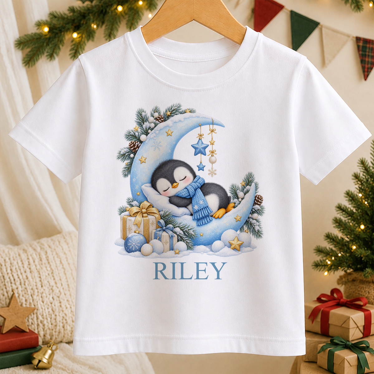 Personalised Sleepy Penguin Moon kids Christmas t-shirt in white with a custom name