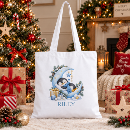 Personalised Sleepy Penguin Moon Christmas tote bag with a custom name