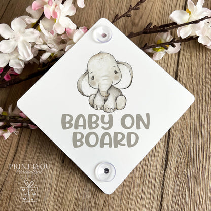 Baby on board car window sign with two suction cups attached to a car window, elephant safari design.