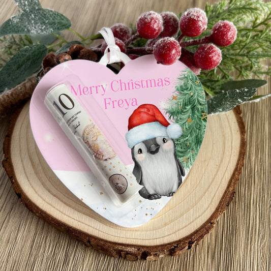 Personalised acrylic heart-shaped money holder with pink penguin design and custom name