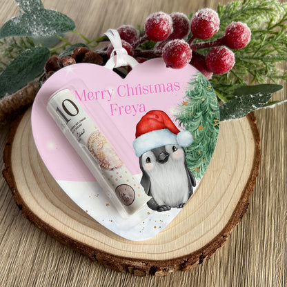 Pink Polar Bear Heart acrylic money holder shown with a folded banknote slotted inside