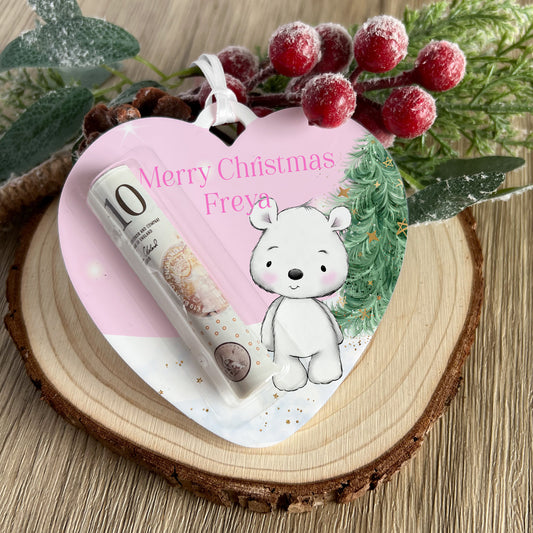 Personalised acrylic Christmas money holder in a Pink Polar Bear Heart design, printed with a name and hung with a ribbon