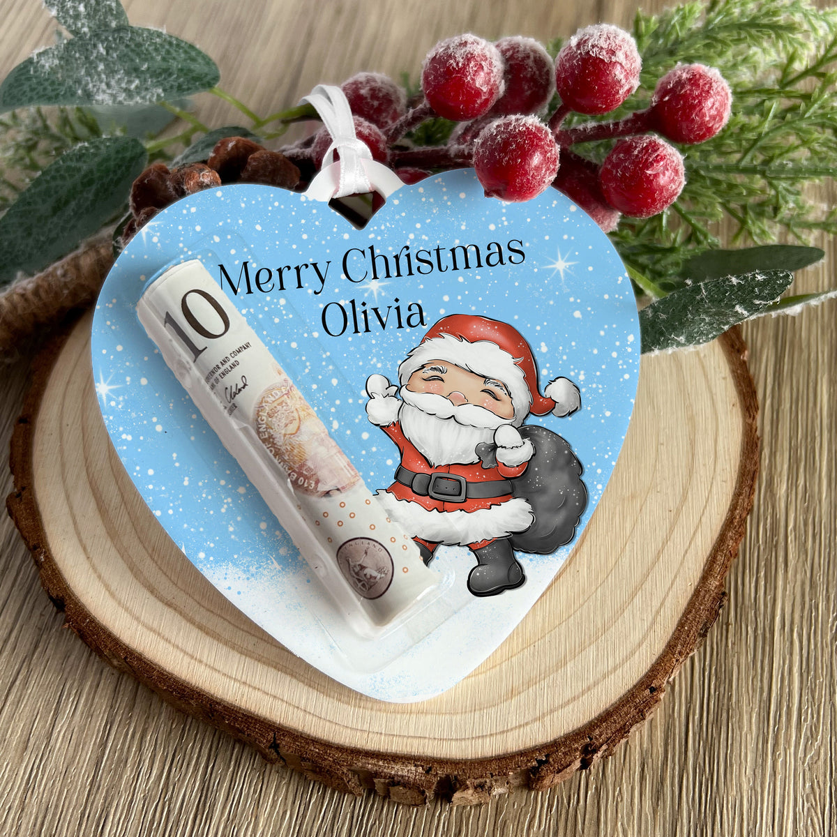 Personalised Reindeer Heart money pouch hanging on a Christmas tree branch