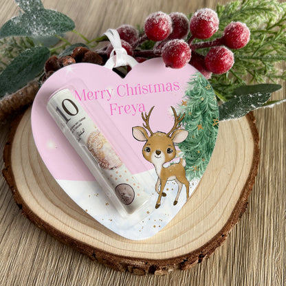 Personalised unicorn reindeer heart money holder hanging on a Christmas tree branch
