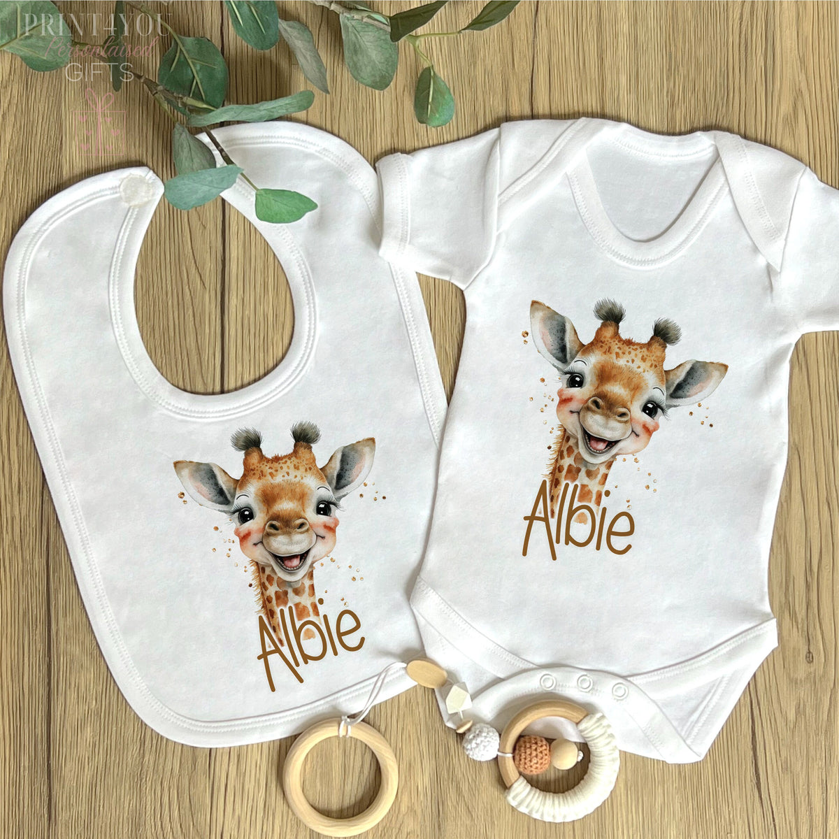 Close-up of the safari giraffe design and personalised name print on soft white cotton.