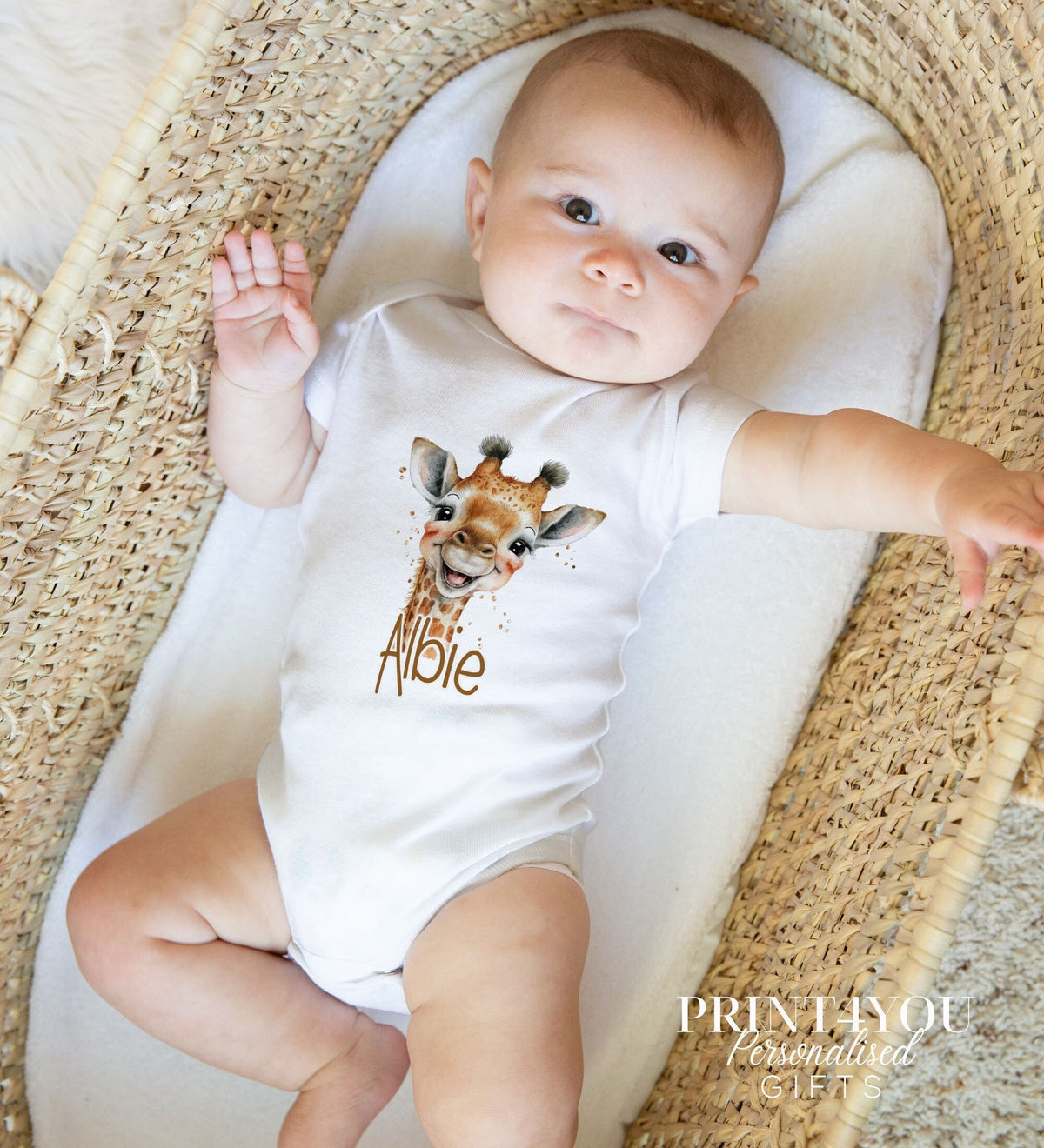 Personalised safari giraffe bib laid flat, printed with the baby's name for a new baby gift.