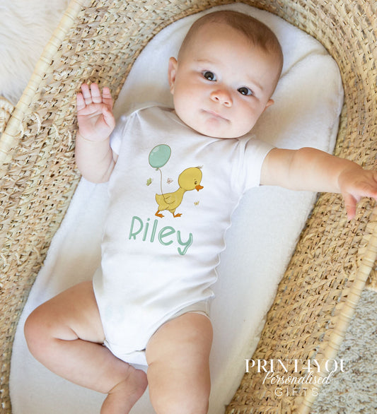 Personalised baby duck bib for a new baby gift set, printed with the baby's name.