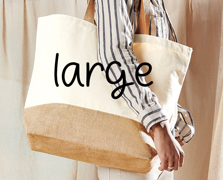 Model carrying a large cream and jute tote bag over one shoulder, labelled 'large' to show size.