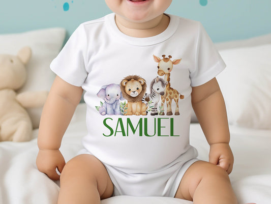Personalised safari jungle animals new baby gift set styled flat, showing vest, sleepsuit and bib.