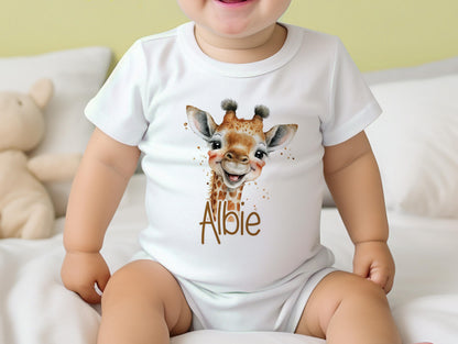 Personalised safari giraffe new baby gift set styled together, showing the bib, vest and sleepsuit.