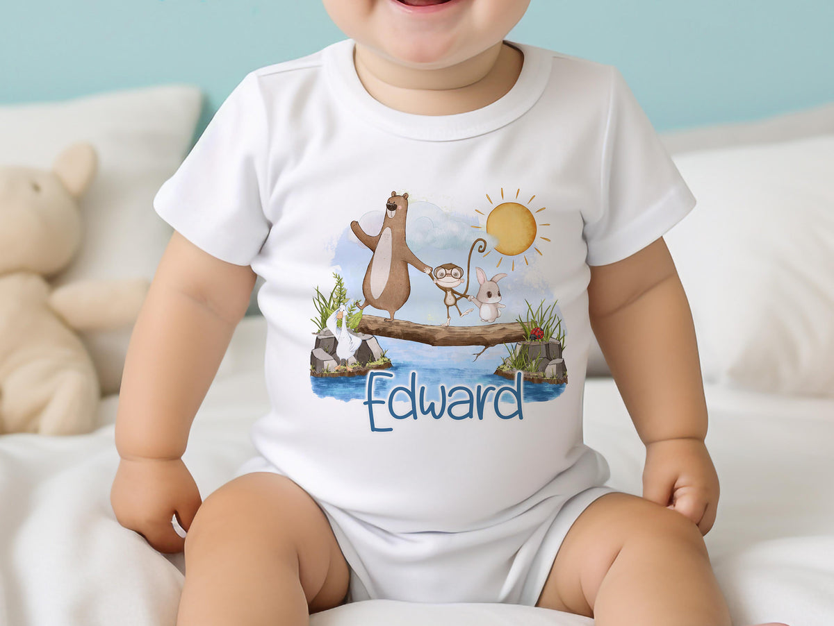 Personalised new baby bib printed with the animals on a log design and the baby's name.
