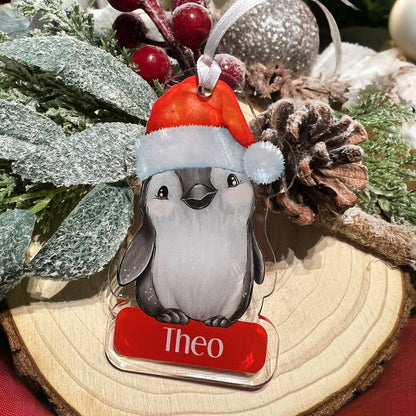 Personalised Penguin acrylic bauble shown to scale, approximately 9cm x 6cm