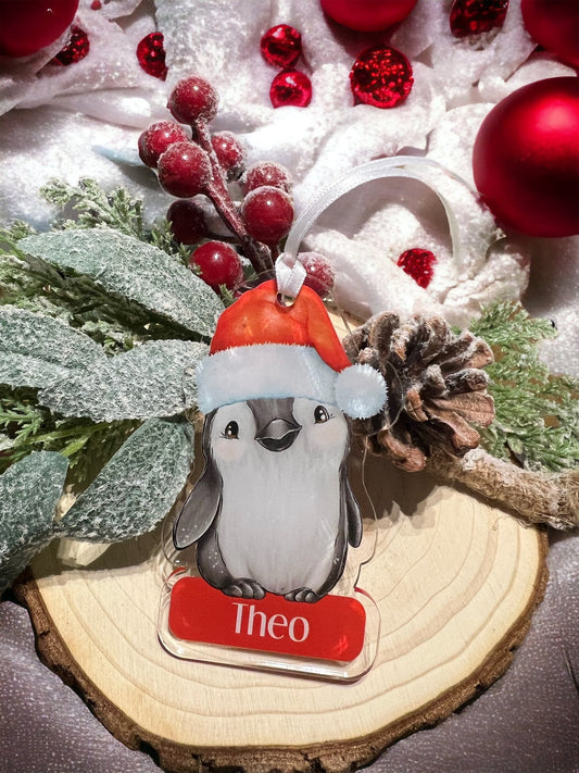Personalised Penguin acrylic Christmas bauble with child's name, shown with optional gift box (Yes Please)