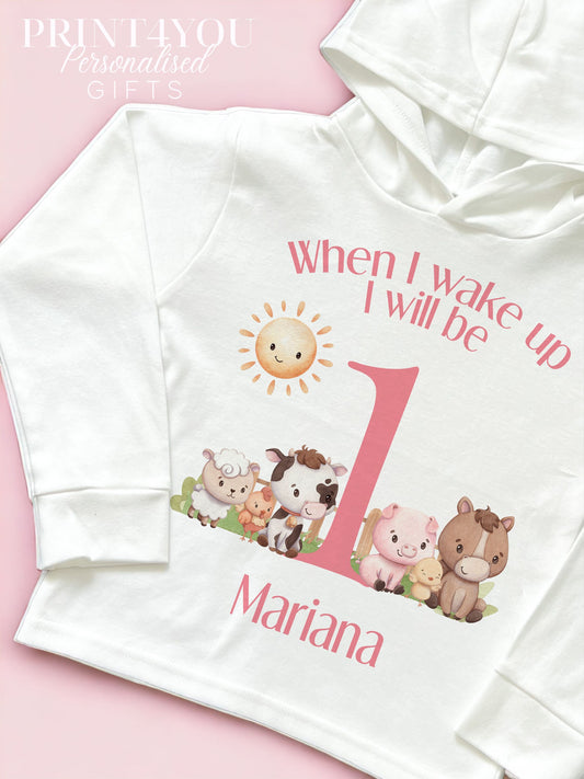 Personalised pink farm animals first birthday bib, printed with a custom name and the number one.