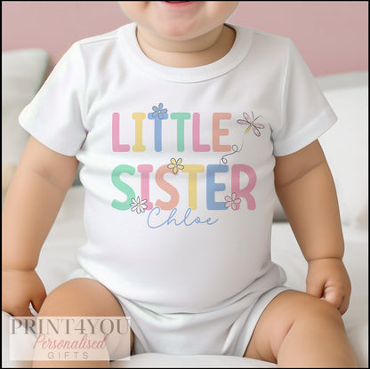 Personalised 'Little Sister' bodysuit folded flat, showing the soft cotton fabric and print.